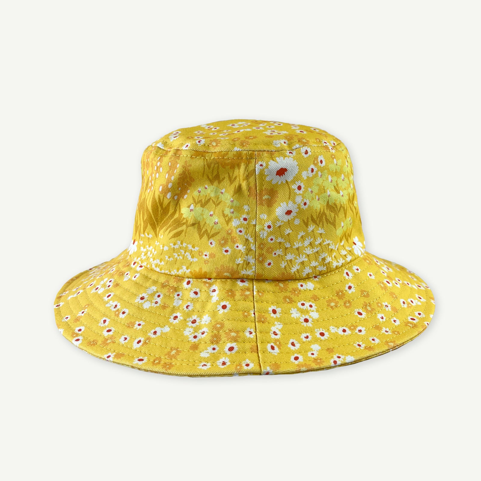 back view of yellow buttercup printed bucket hat which has a center back seam running through the main section of the hat and brim.