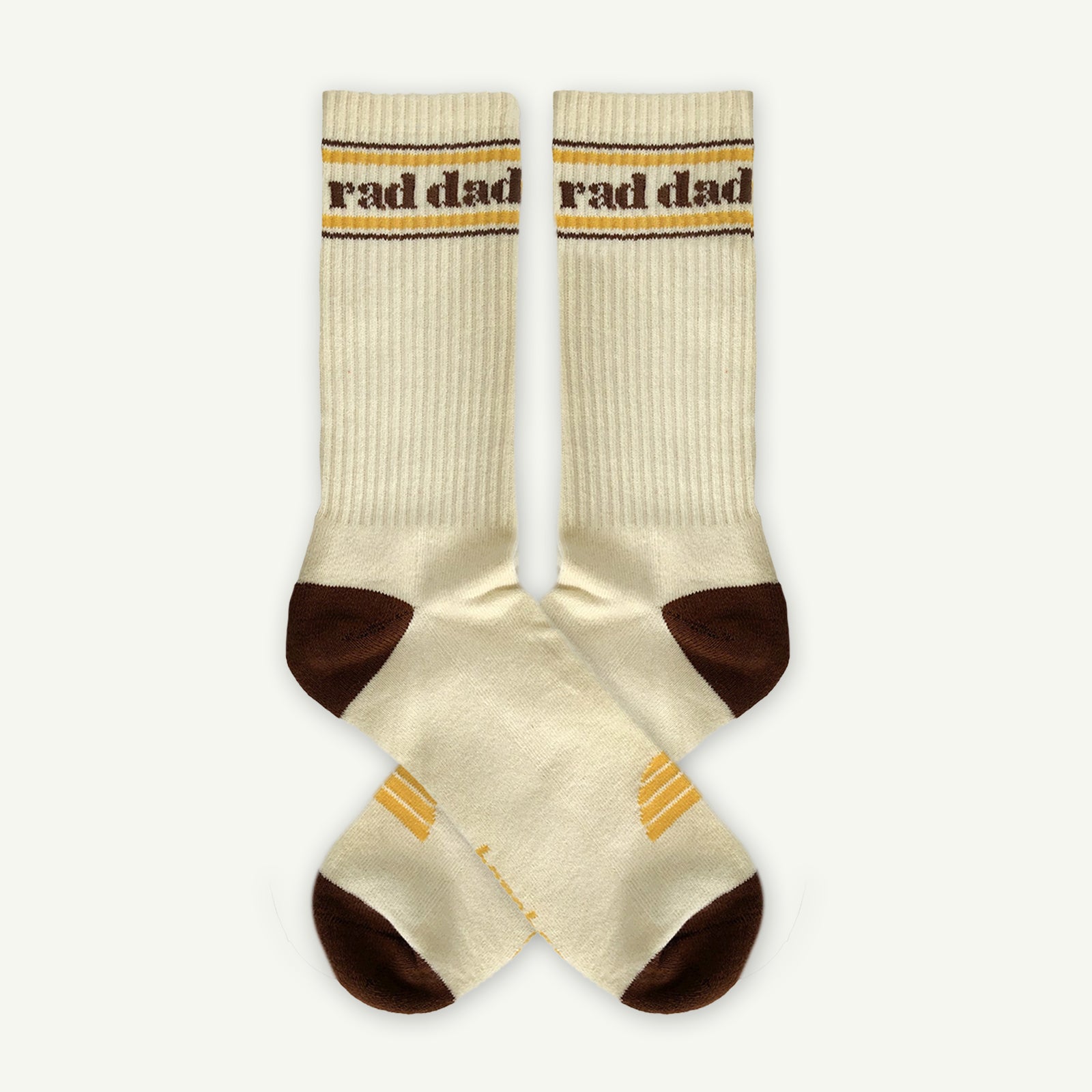 Beige socks with 'rad dad' text on a white background
