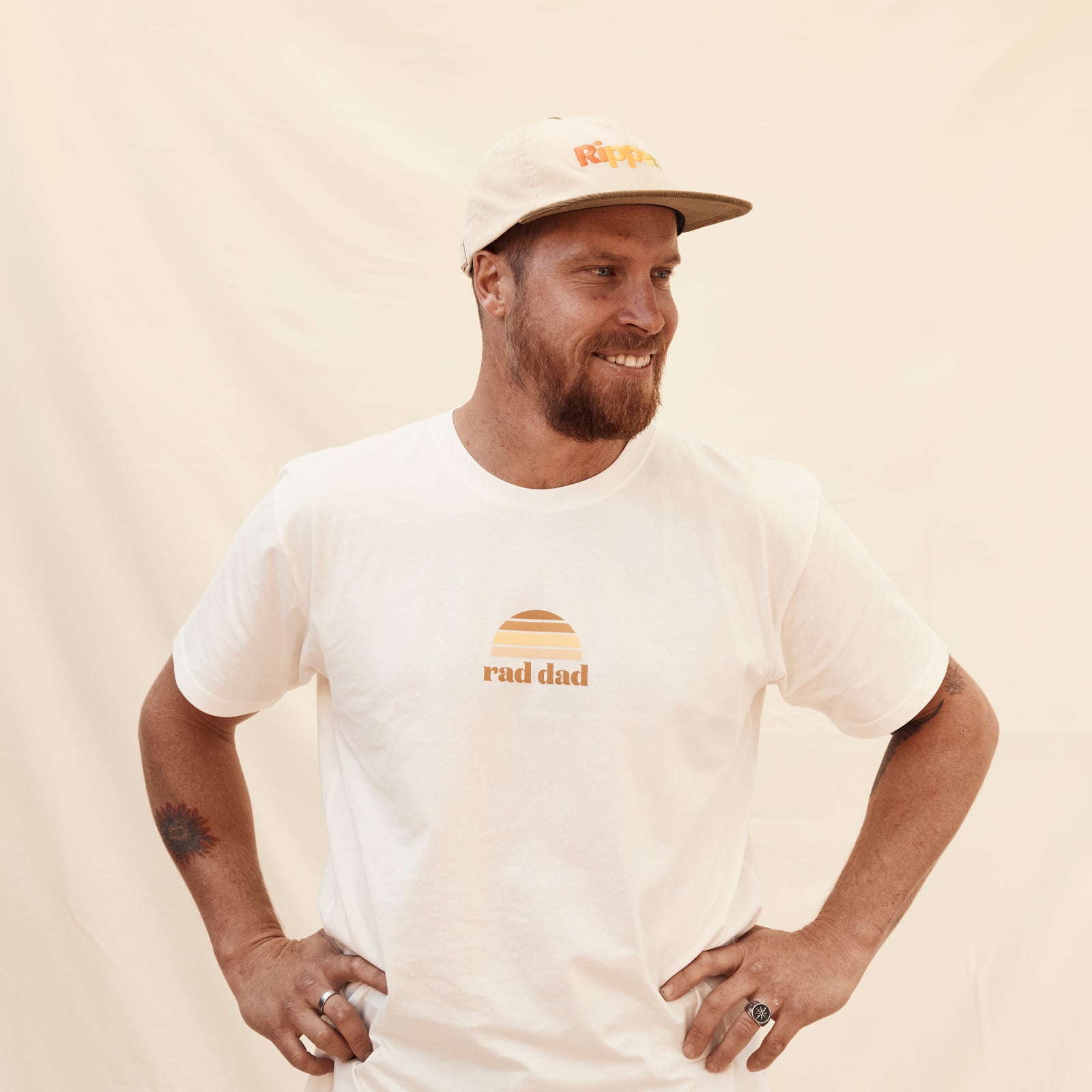 Man wearing White "Rad Dad" Tee and "Ripper" cord cap