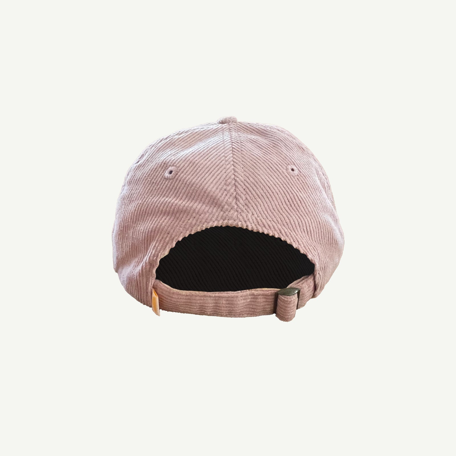 back view of pink corduroy cap with adjuster strap with metal fitting.
