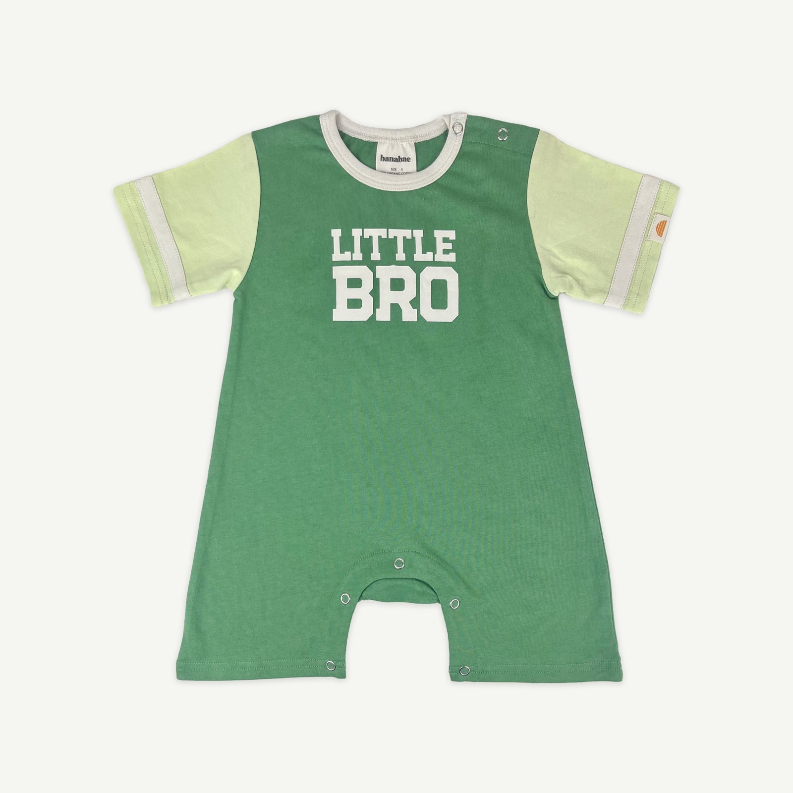 Green spliced playsuit for the little bro in your crew. Sporty stripes on the sleeve. Silver snaps at the crotch for easy nappy changes.