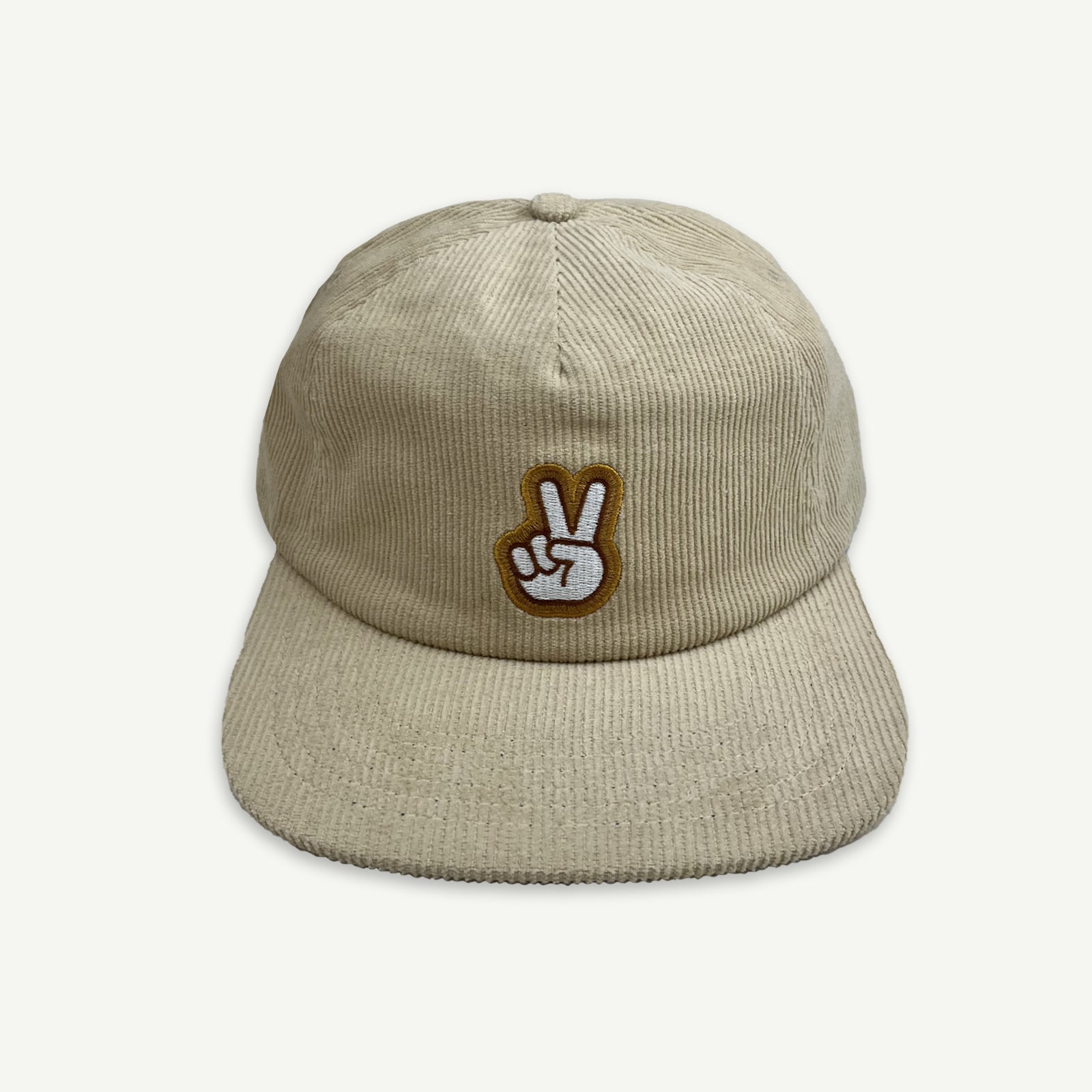 Ecru cord pinch front flat Cap with V-Sign representing peace embroidered in white, with thin brown boarder and larger boarder in golden yellow