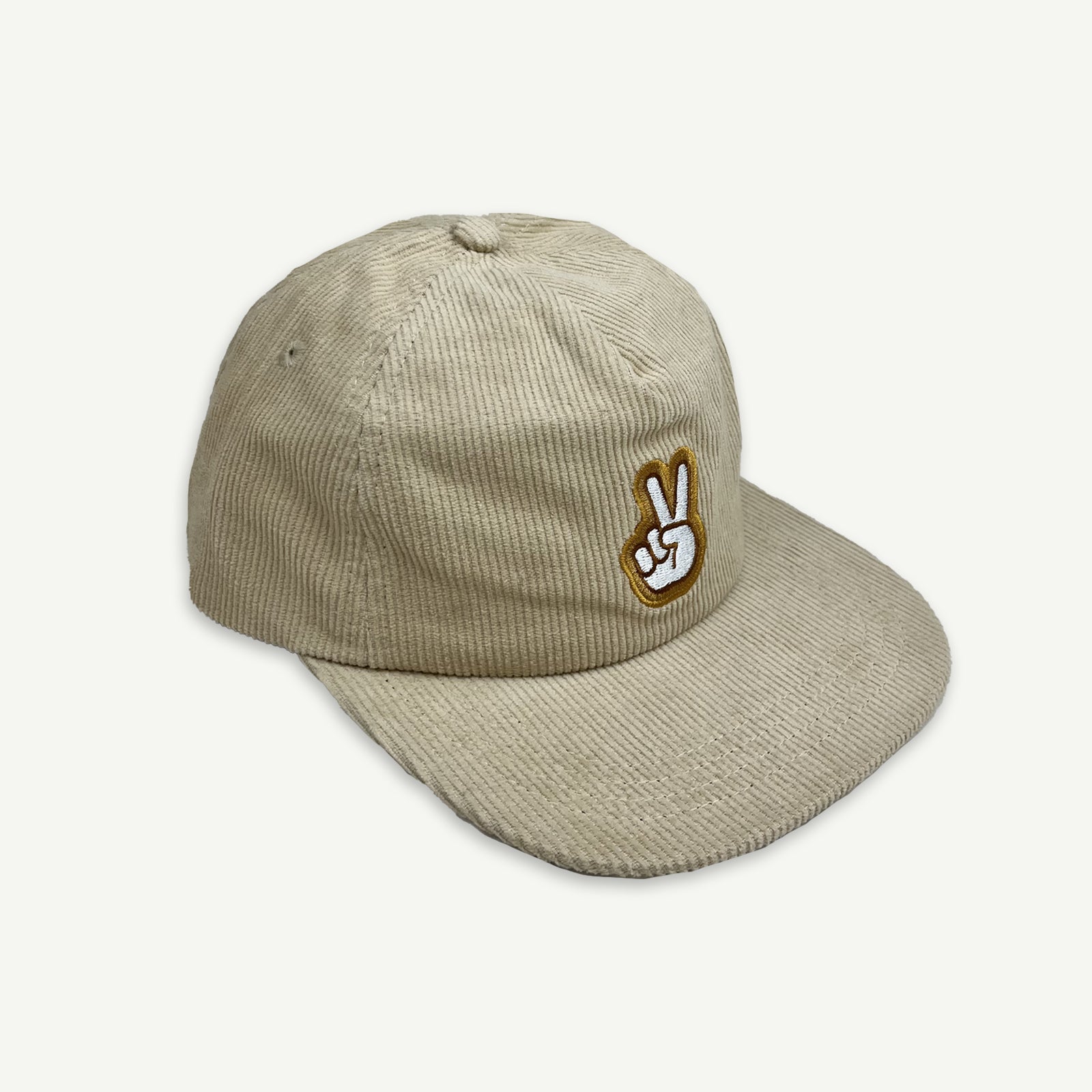 Off center view of Ecru cord pinch front flat Cap with V-Sign representing peace embroidered in white, with thin brown boarder and larger boarder in golden yellow