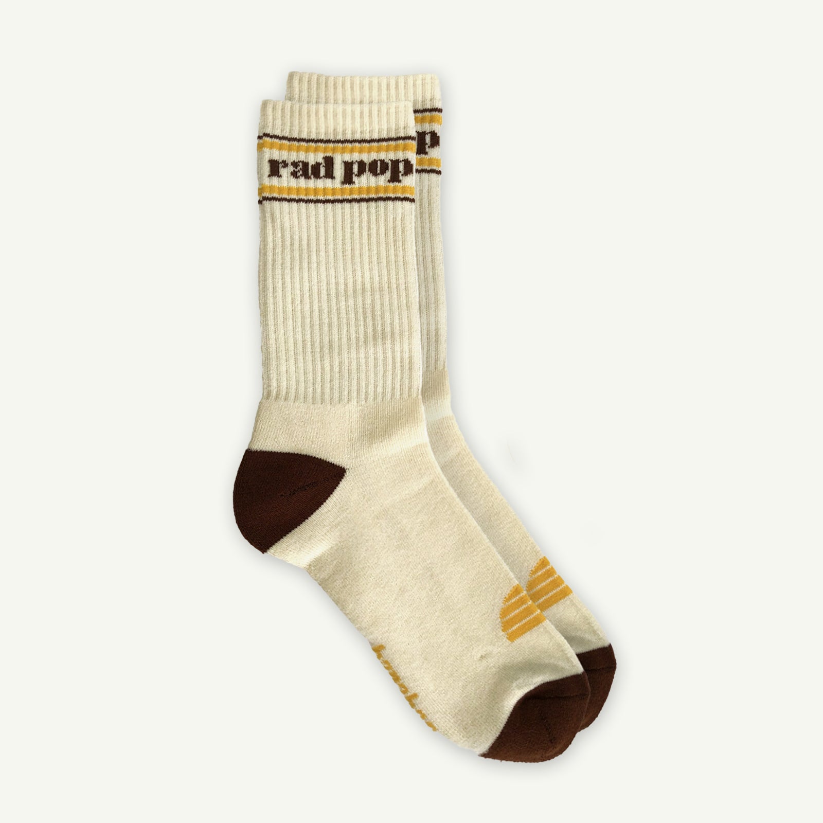 Beige sock with brown accents and 'rad pop' text on a white background