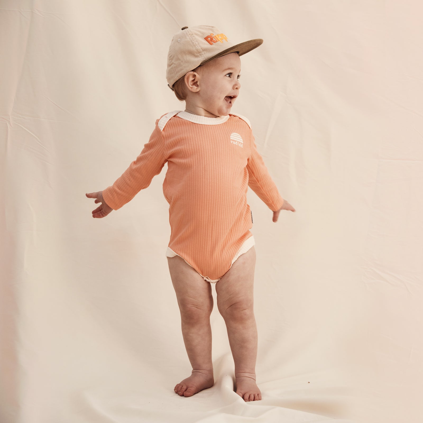 Peach Ribbed Organic Cotton Long Sleeve Onesie